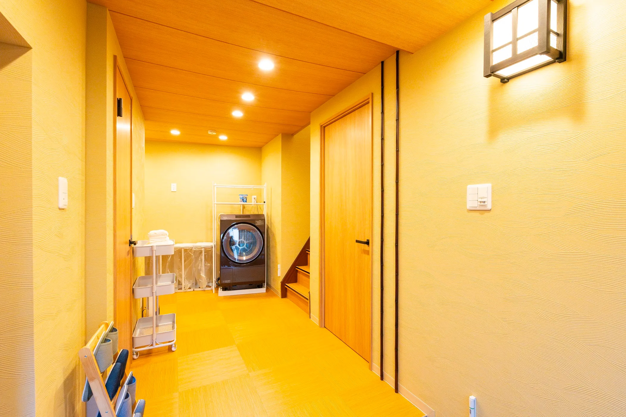 The ground-floor corridor with a drum washer-dryer